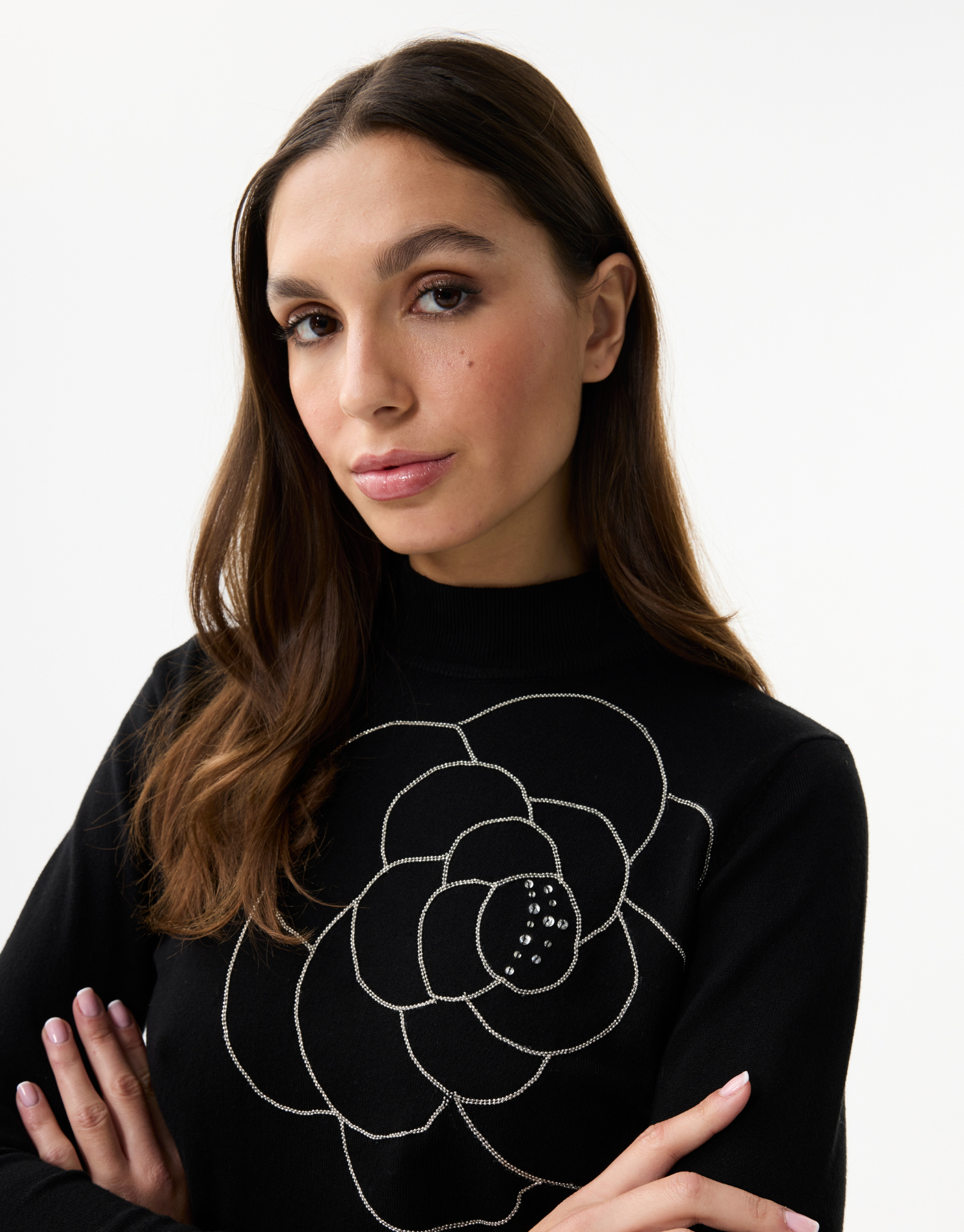 Women's fine knit turtleneck sweater with rhinestone flower pattern