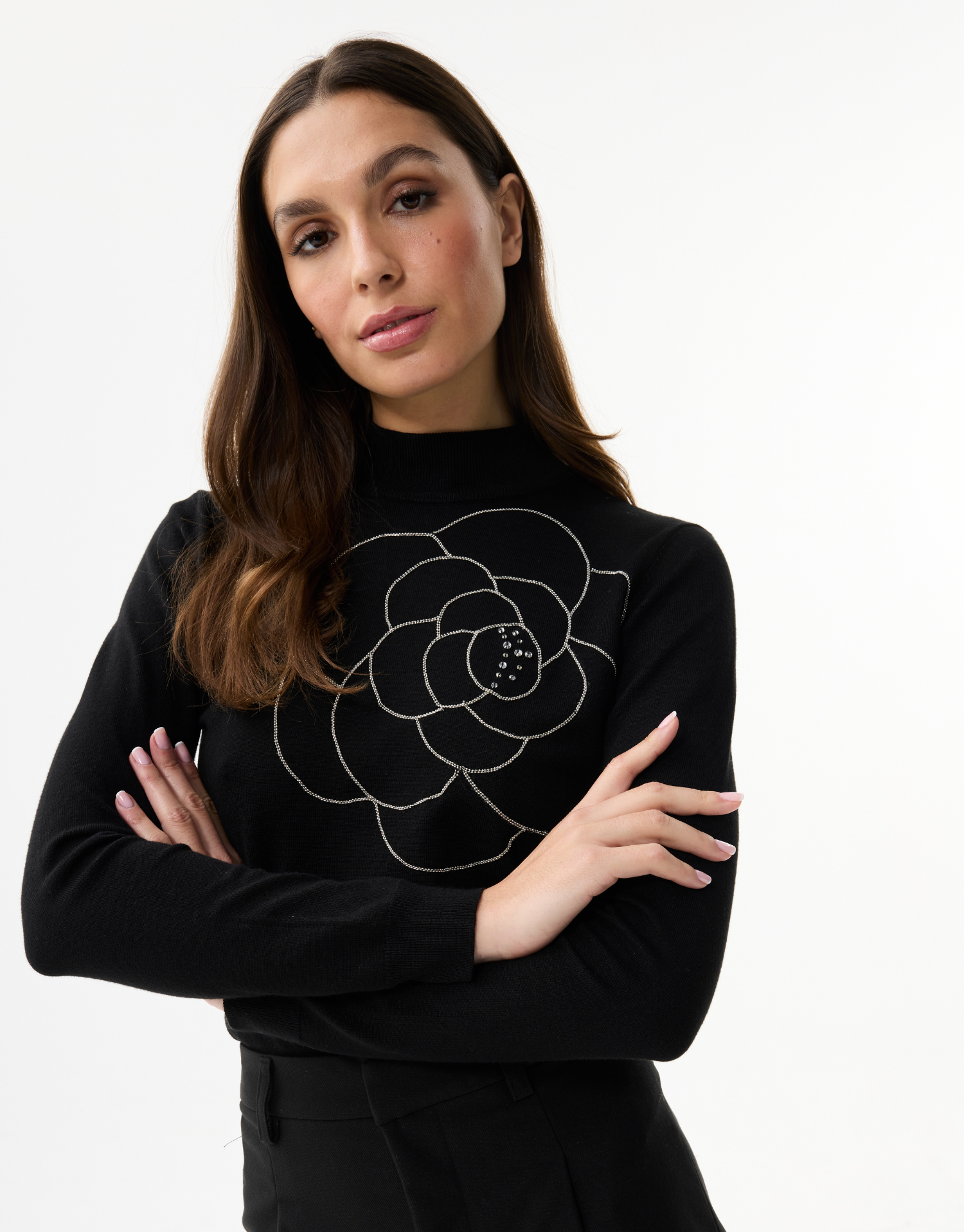 Women's fine knit turtleneck sweater with rhinestone flower pattern