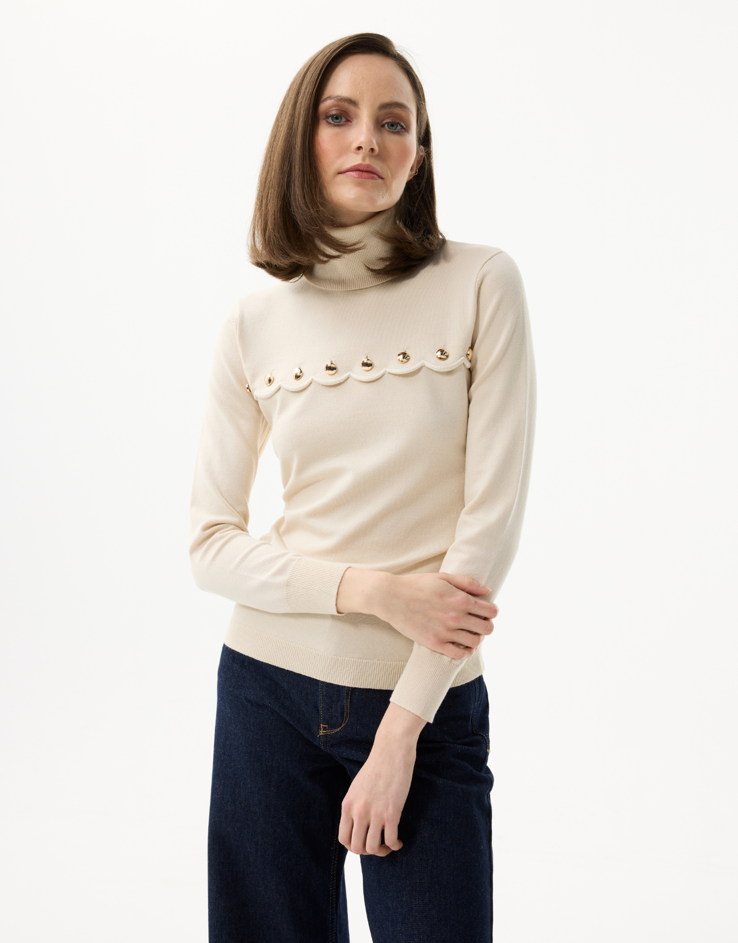 Women's turtleneck sweater with scalloped details and golden buttons