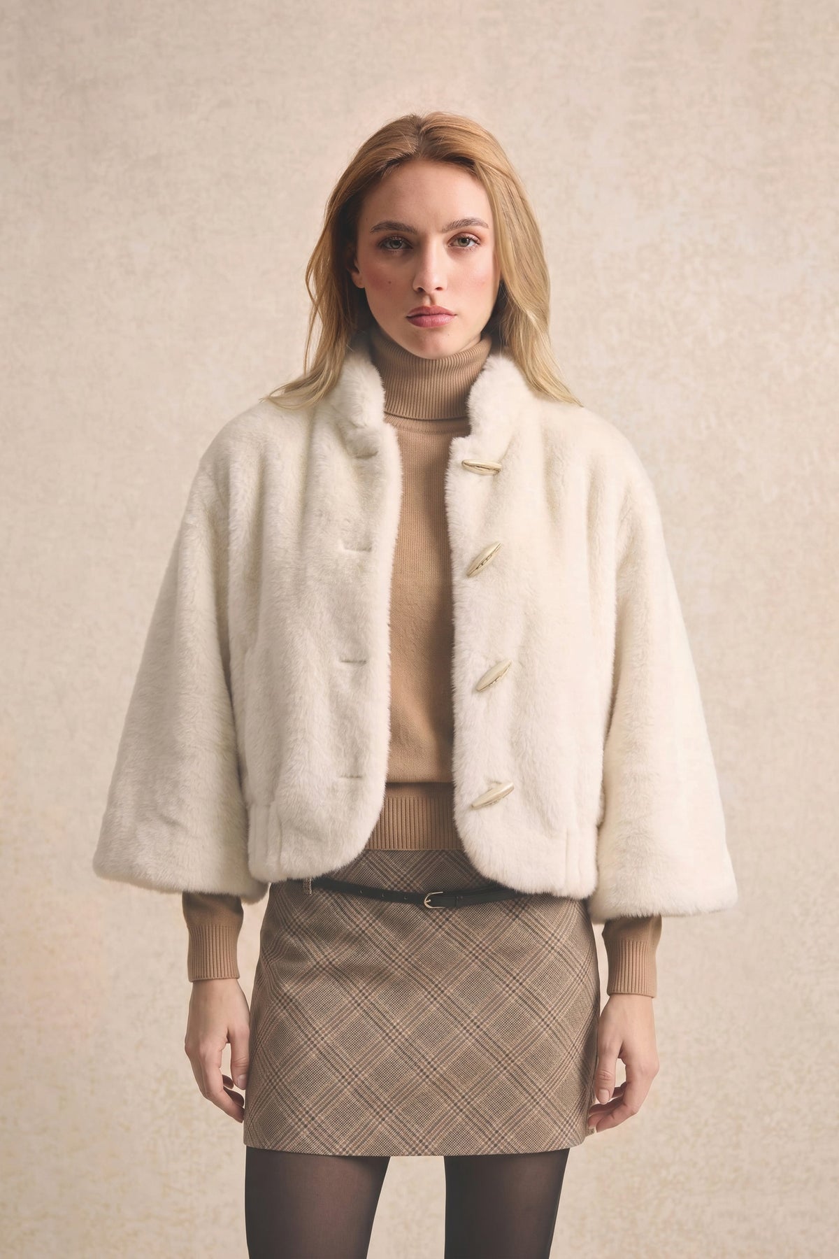 Manteau effet fourrure écru
