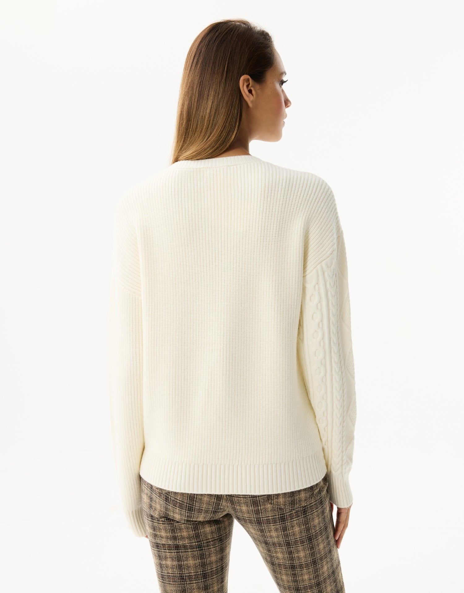Twisted sweater with asymmetrical details