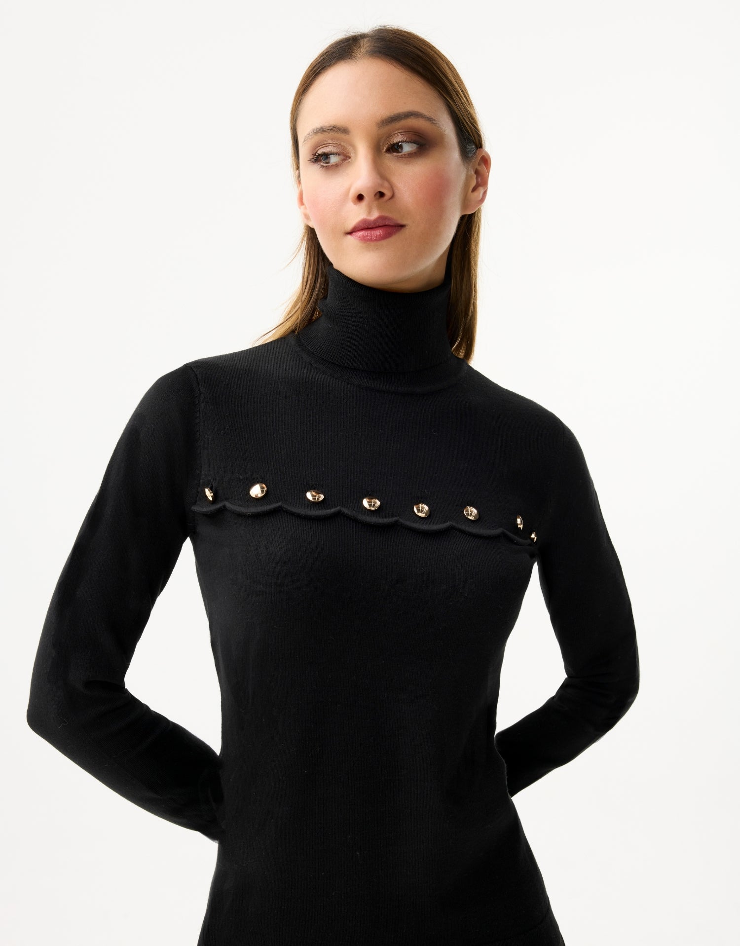 Women's turtleneck sweater with scalloped details and golden buttons