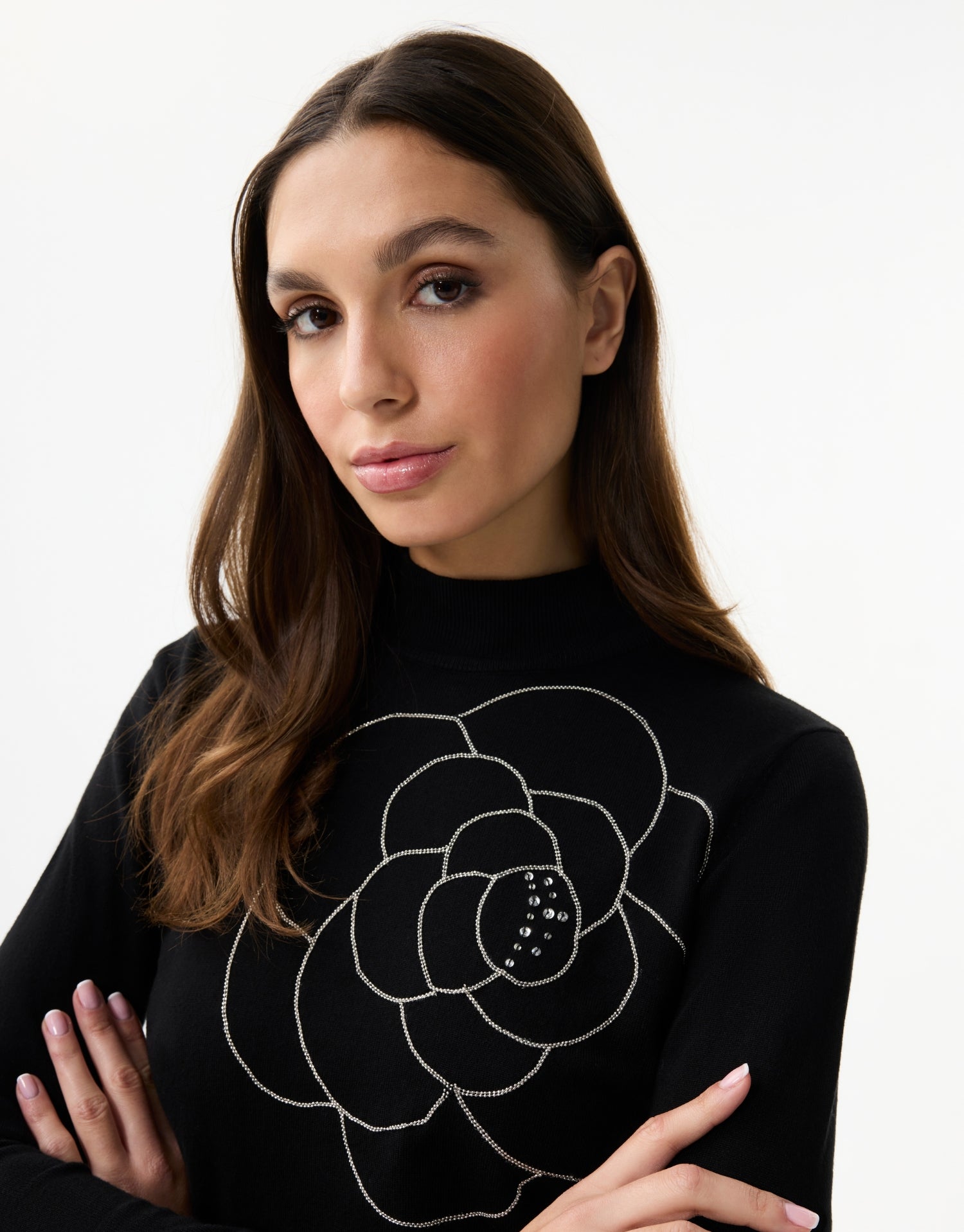 Women's fine knit turtleneck sweater with rhinestone flower pattern
