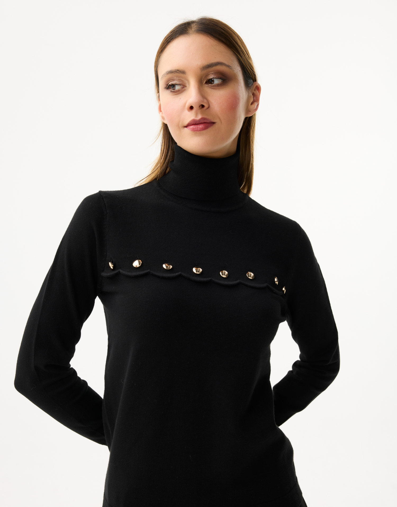 Women's turtleneck sweater with scalloped details and golden buttons