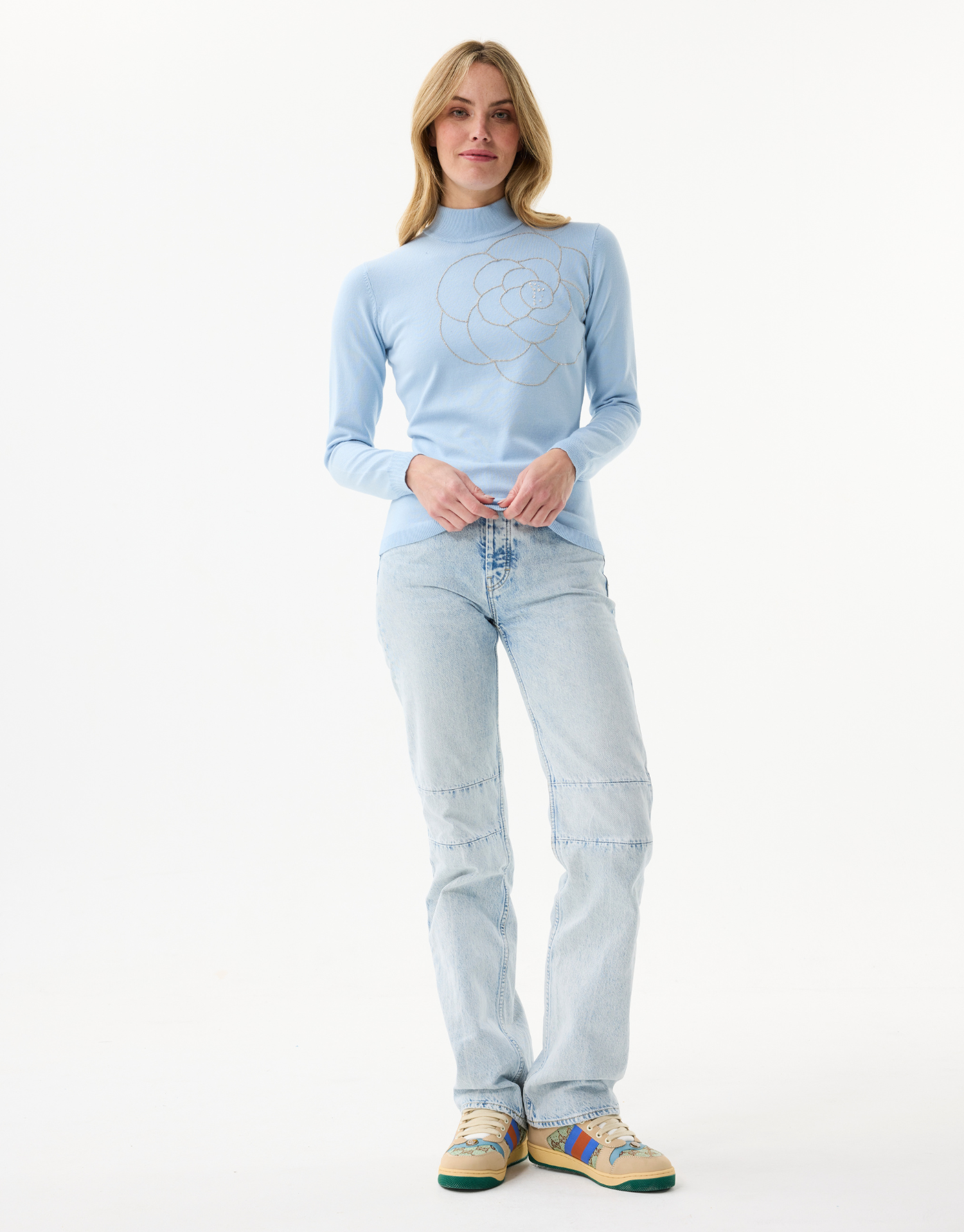 Women's fine knit turtleneck sweater with rhinestone flower pattern