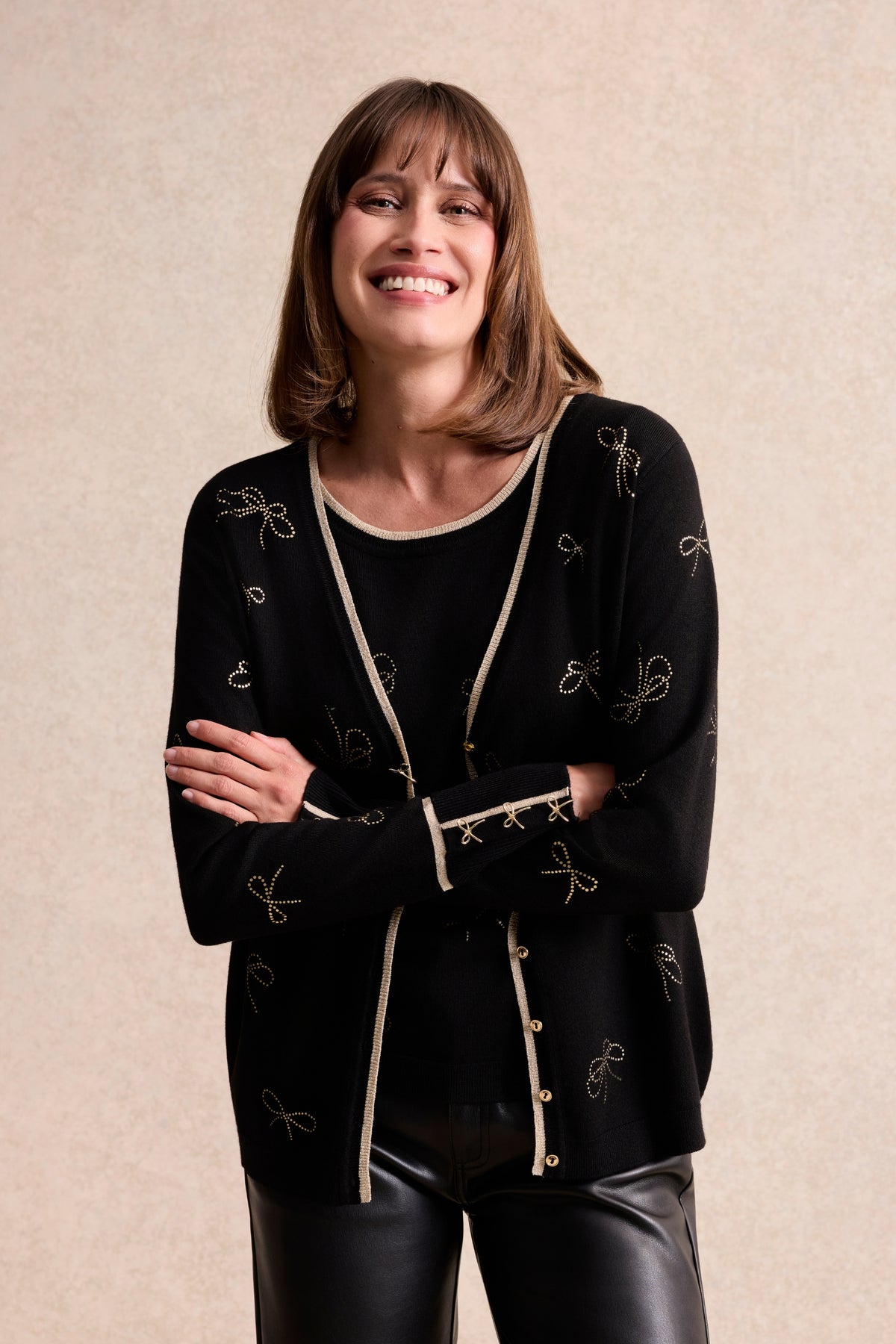 Twin-set à motifs nœuds dorés noir