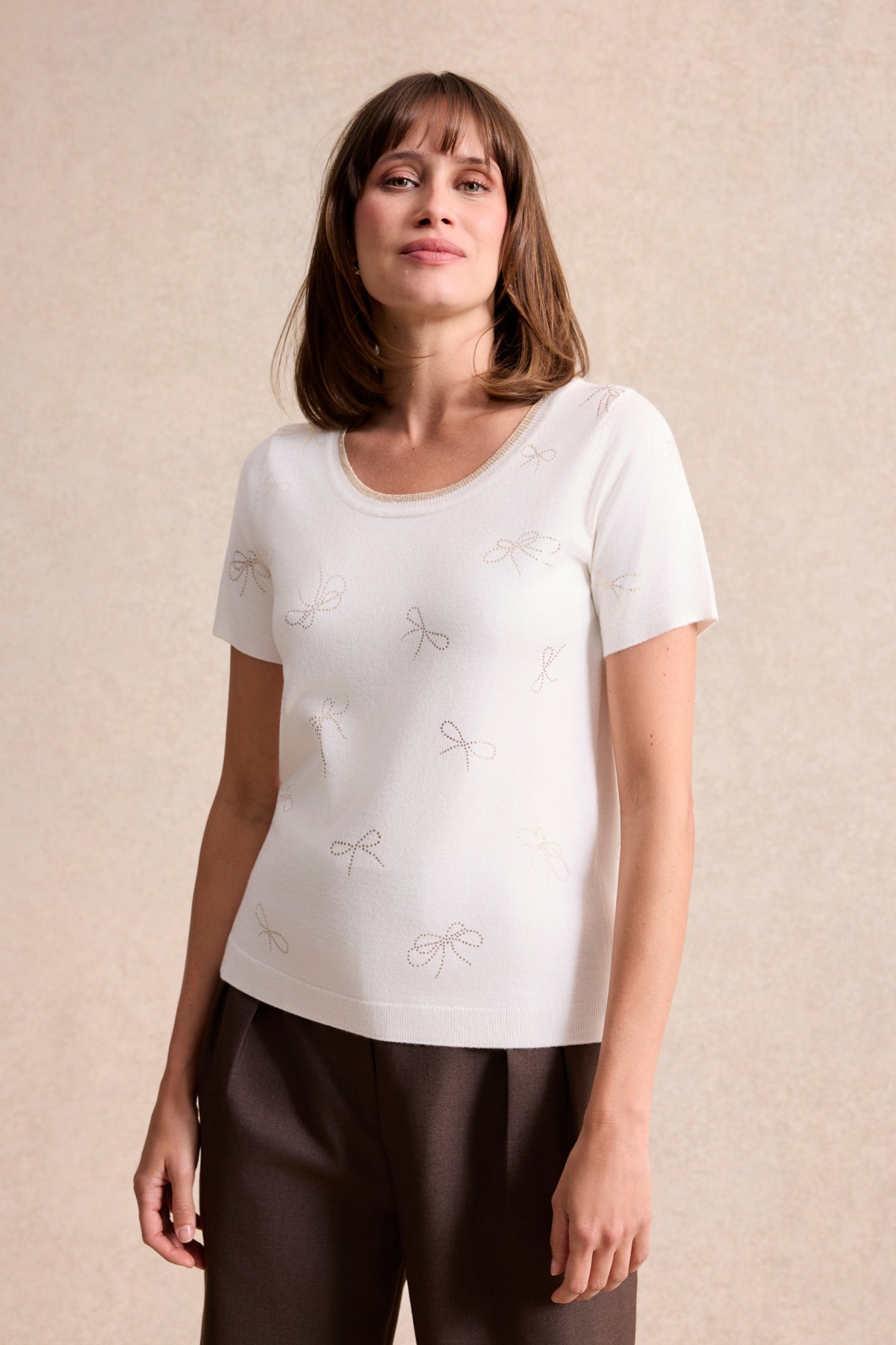 Twin-set à motifs nœuds dorés écru