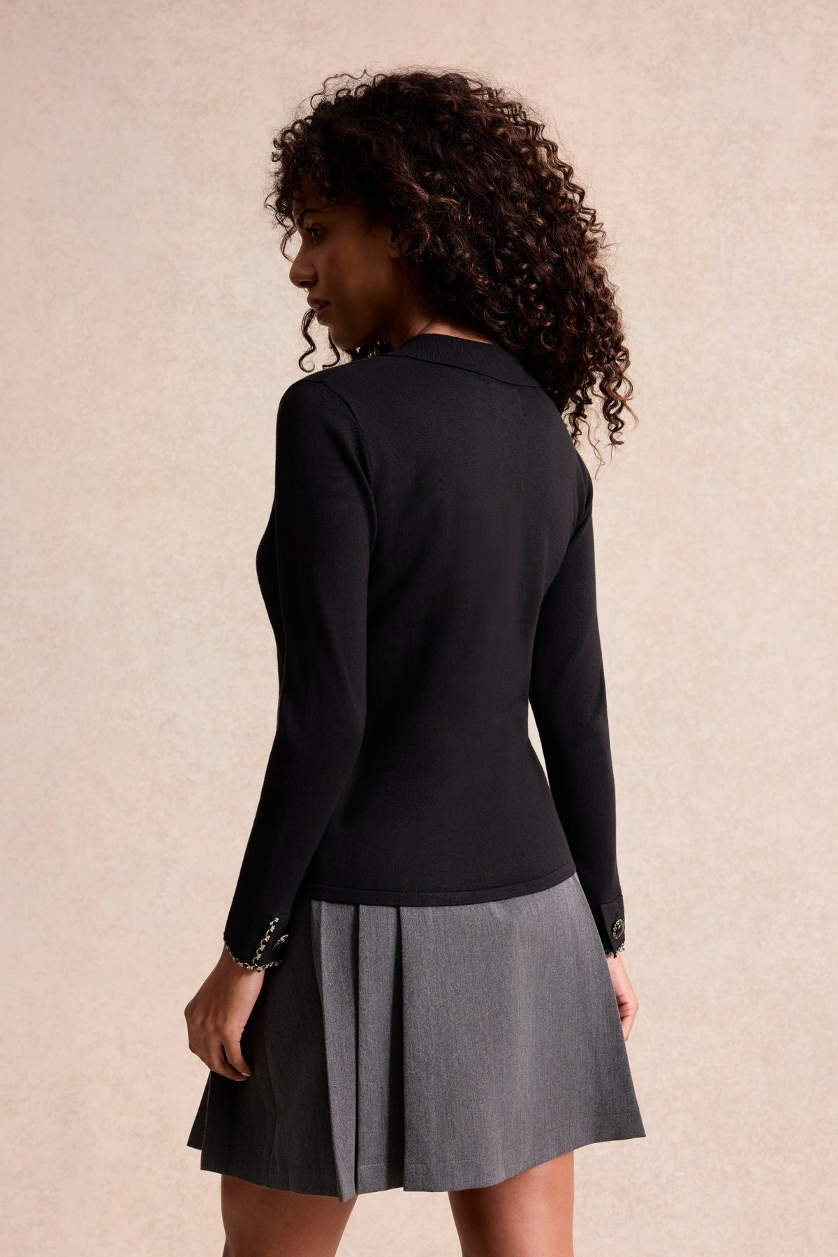 Pull col polo à boutons bijoux